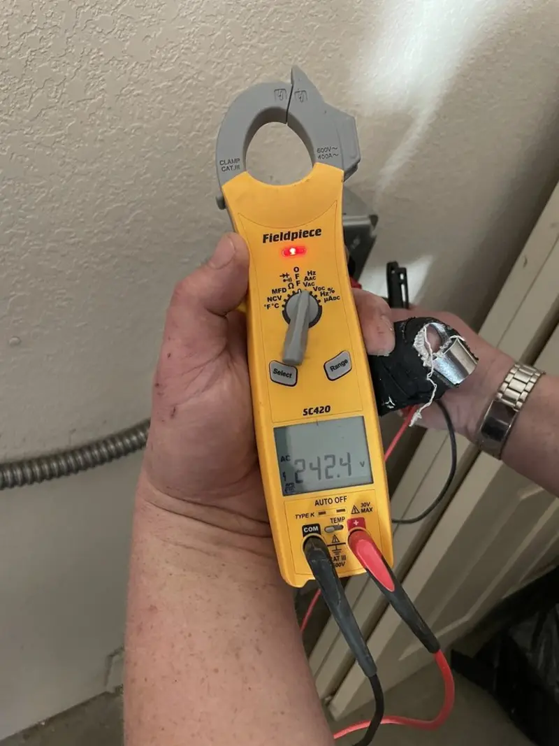 Voltage testing with clamp meter during Outlet Installation in West Samoset